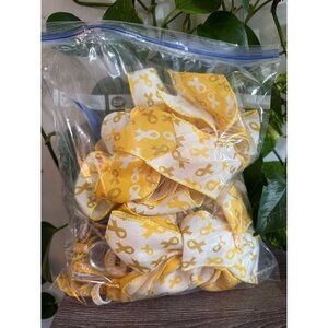 Large bag of childhood gold, cancer, ribbon, buttons, bracelets, and ribbon